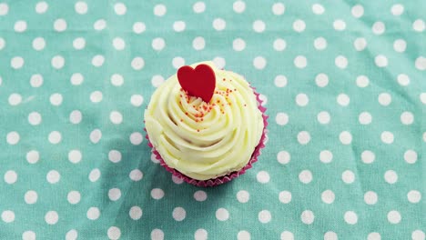 cupcake against polka dot background