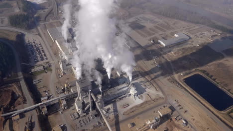 smoke comes out from the factory in quesnel city in the cariboo regional district of british columbia, canada