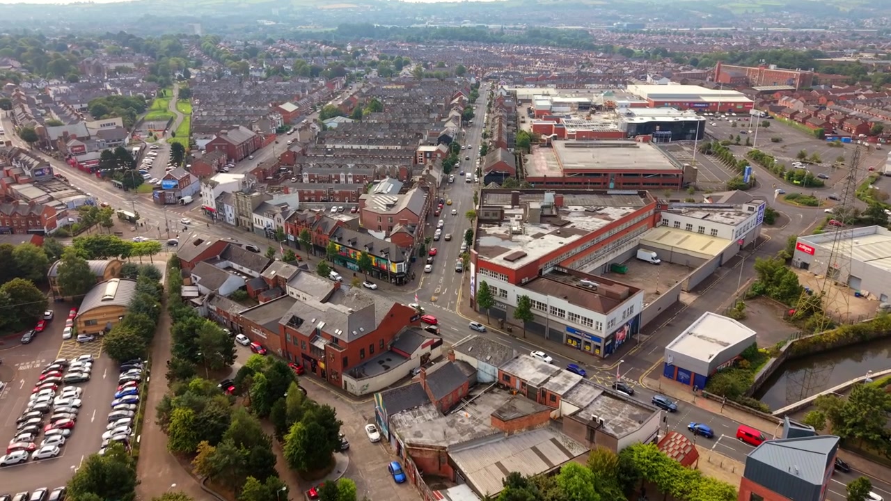 Wide advancing 4K 25FPS (slow motion) aerial video of the Newtownards Road and CS Lewis Square in East Belfast, Northern Ireland, UK. Produced in 3840x2160 with Rec709 colour.