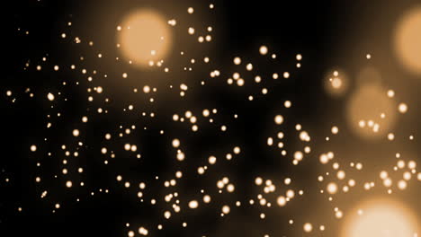 animación de múltiples manchas doradas brillantes de luz que se mueven en movimiento hipnótico sobre un fondo negro