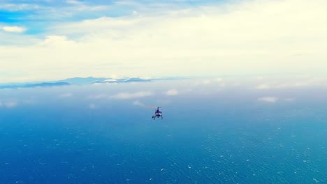 helicopter flying over the cook strait ocean and white clouds towards the south island of new zealand