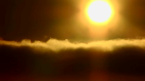 Time-lapse-of-the-sun-behind-golden-clouds