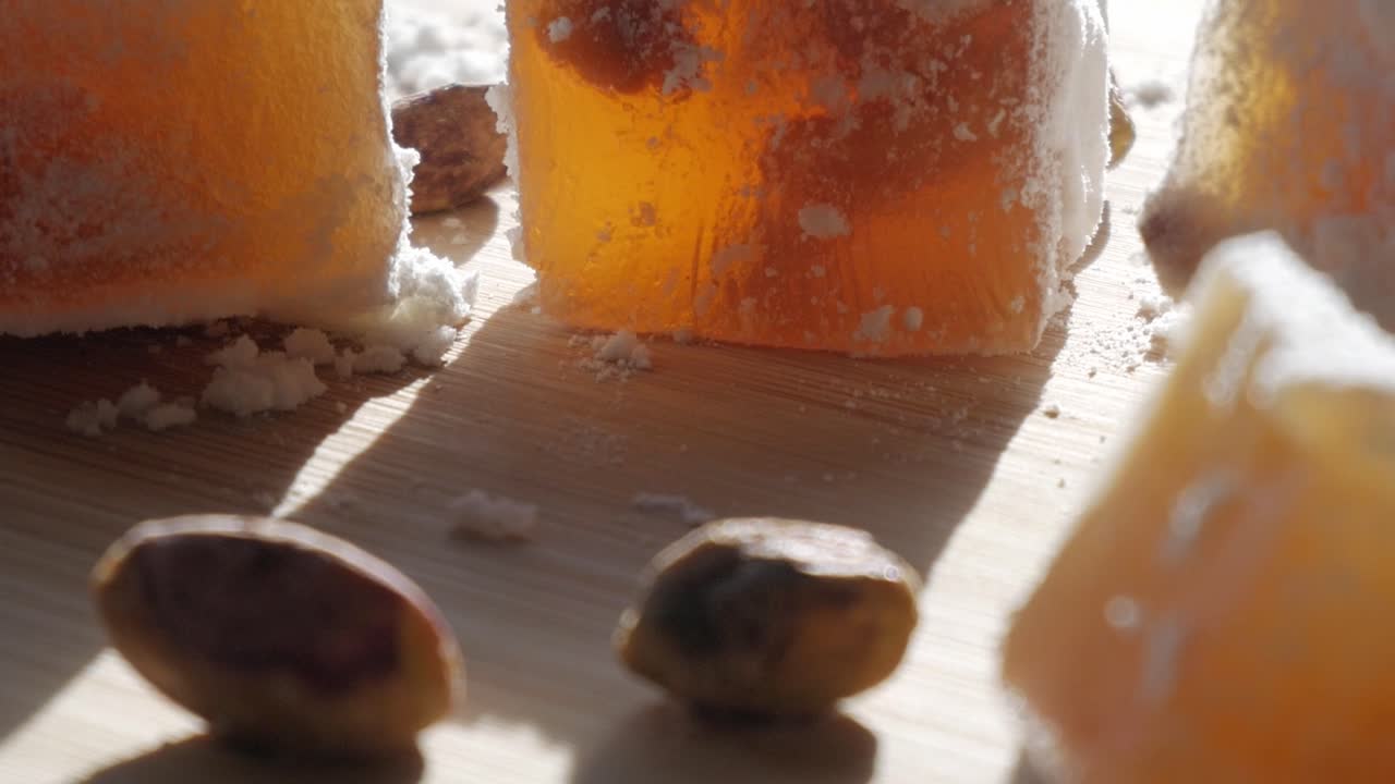 Sweet amber cubes of Cyprus delight dusted with powdered sugar in soft morning light