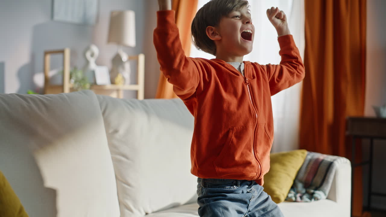 Excited gamer win competition rejoicing virtual victory sitting couch closeup