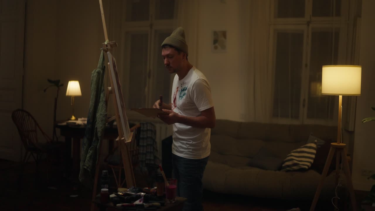 Man painting at night