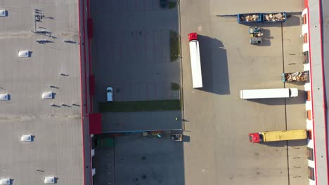 aerial view of cargo containers and distribution warehouse