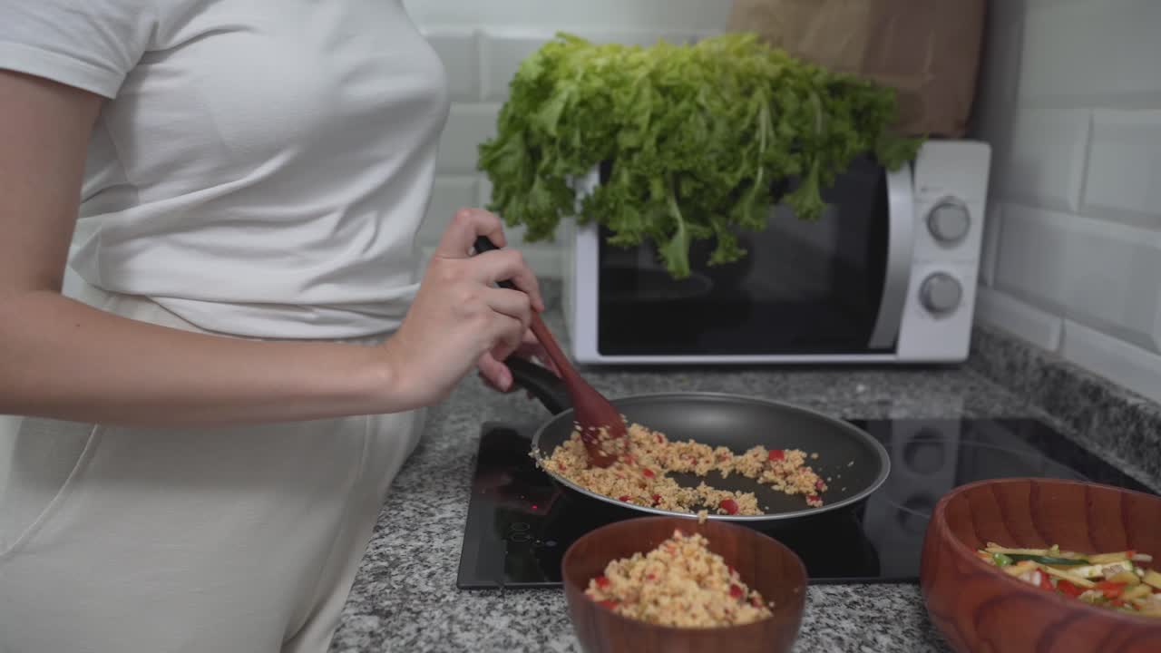 Woman Eating a Healthy Meal in the Kitchen