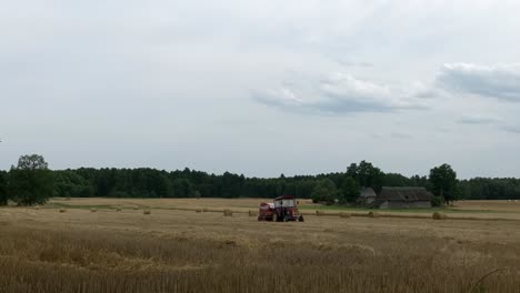 experience the art of baling as the tractor rolls straw into cylindrical bundles