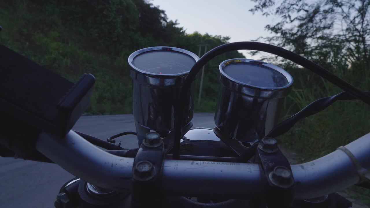 Motorcycle Dashboard View on a Country Road