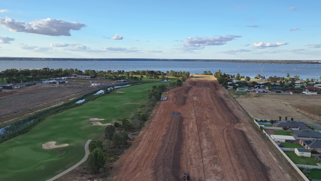 Aerial rising up over the new homes construction stage in Yarrawonga, Victoria, Australia