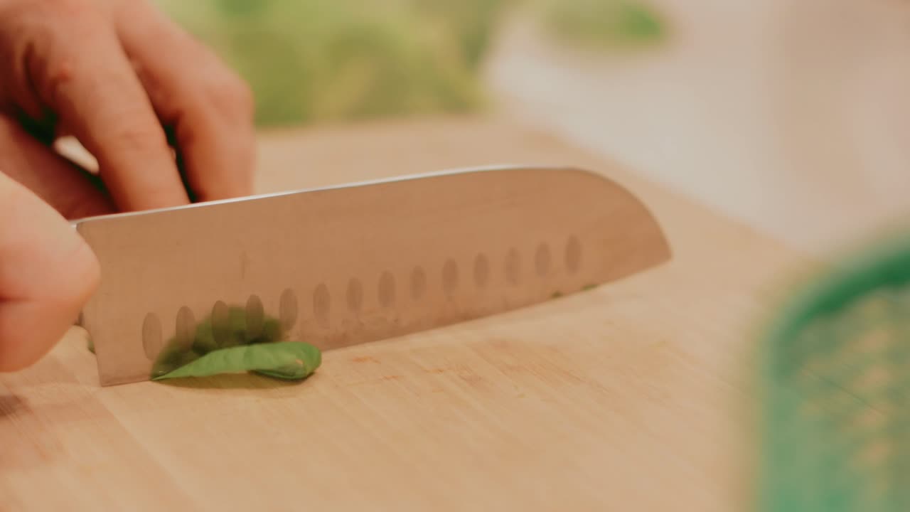 chopping fresh vegetables for a salad on a cutting board