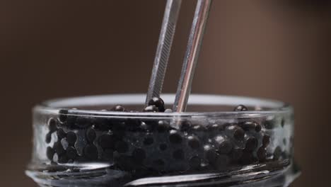 Serving Black Caviar with Tongs