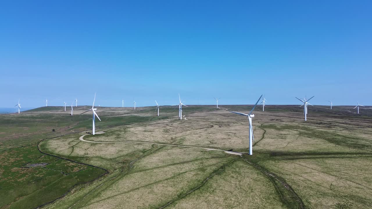 Aerial view of wind turbines farm to produce clean renewable sustainable energy target netzero