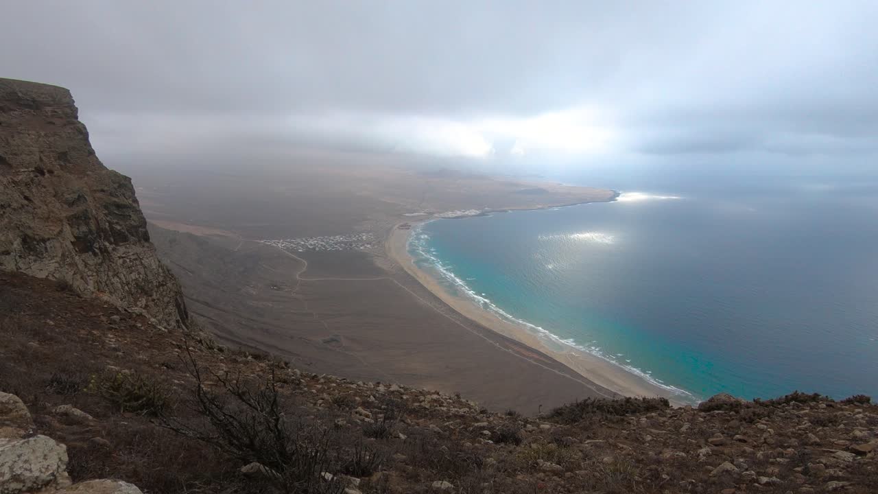 Blue Beach Of Playa de Famara From The Viewpoint Of Famara Cliff During Daytime In Lanzarote, Canary Islands, Spain. timelapse