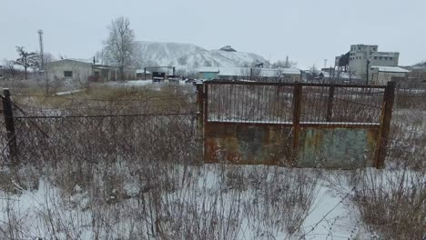 snowy abandoned industrial site