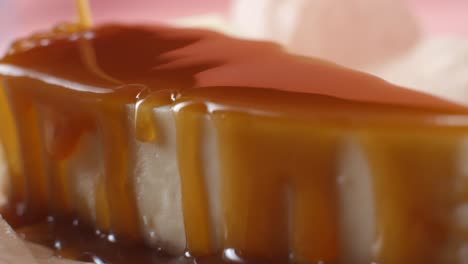 close up of caramel drizzled cheesecake slice