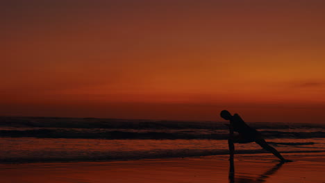 yoga on the beach at sunset