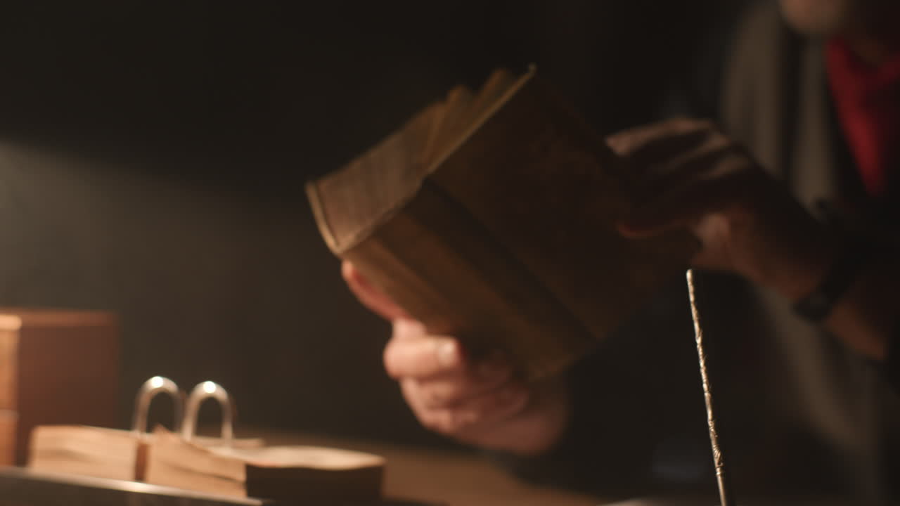 Old passionate man read a book in his office at night