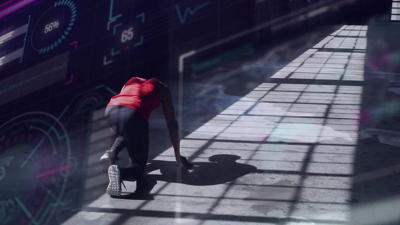 Vertical video: Athlete shifting onto hands pushing off starting sprint along corridor for speed