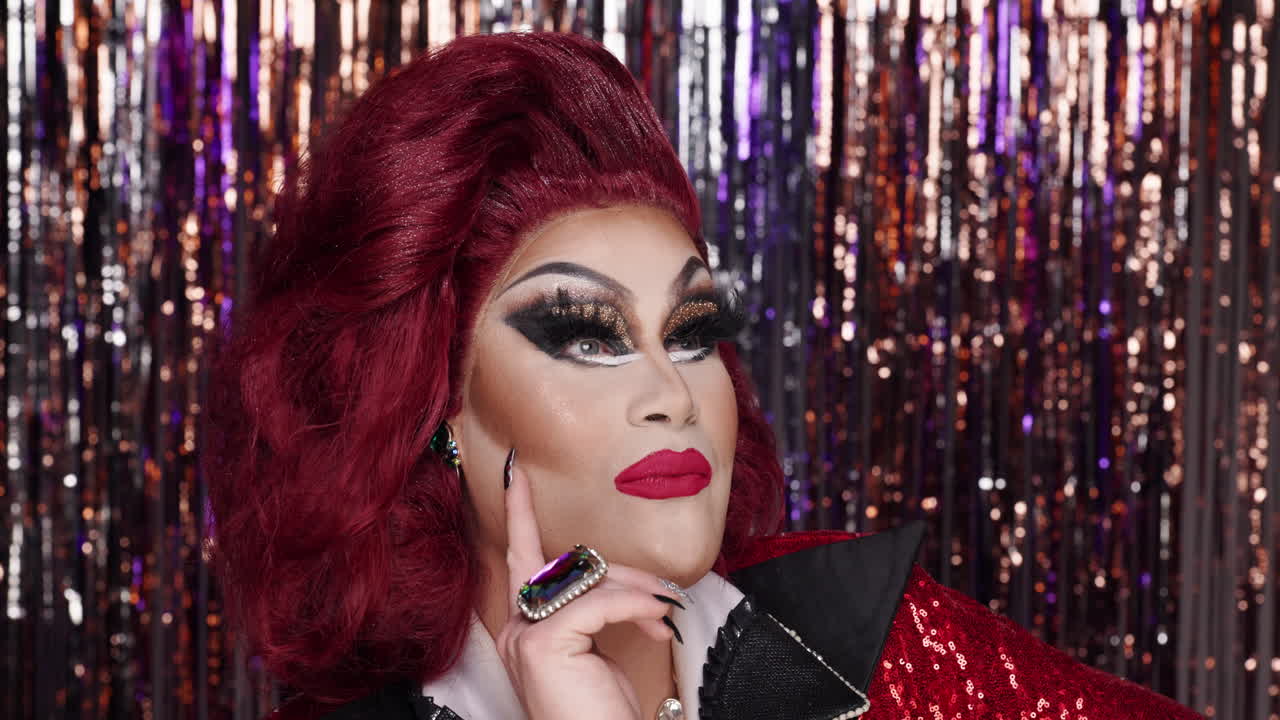 Drag queen portrait with makeup and sequin jacket