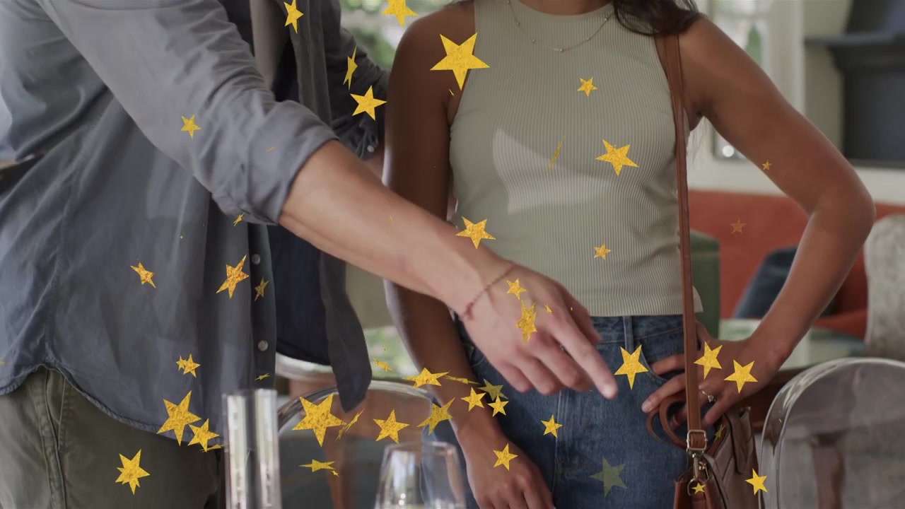 Woman pointing, man moving plates and adjusting cutlery, preparing dinner, yellow stars overlaying