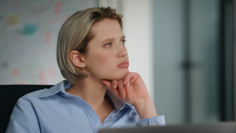 thoughtful businesswoman thinking work issue sitting company workspace close up.