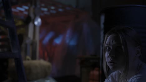 distressed young woman in a dimly lit, mysterious setting