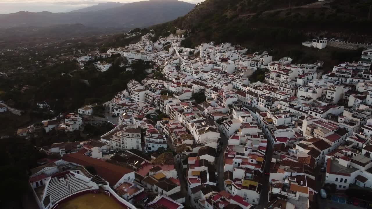 Iconic township of Mijas with white buildings, aerial drone view