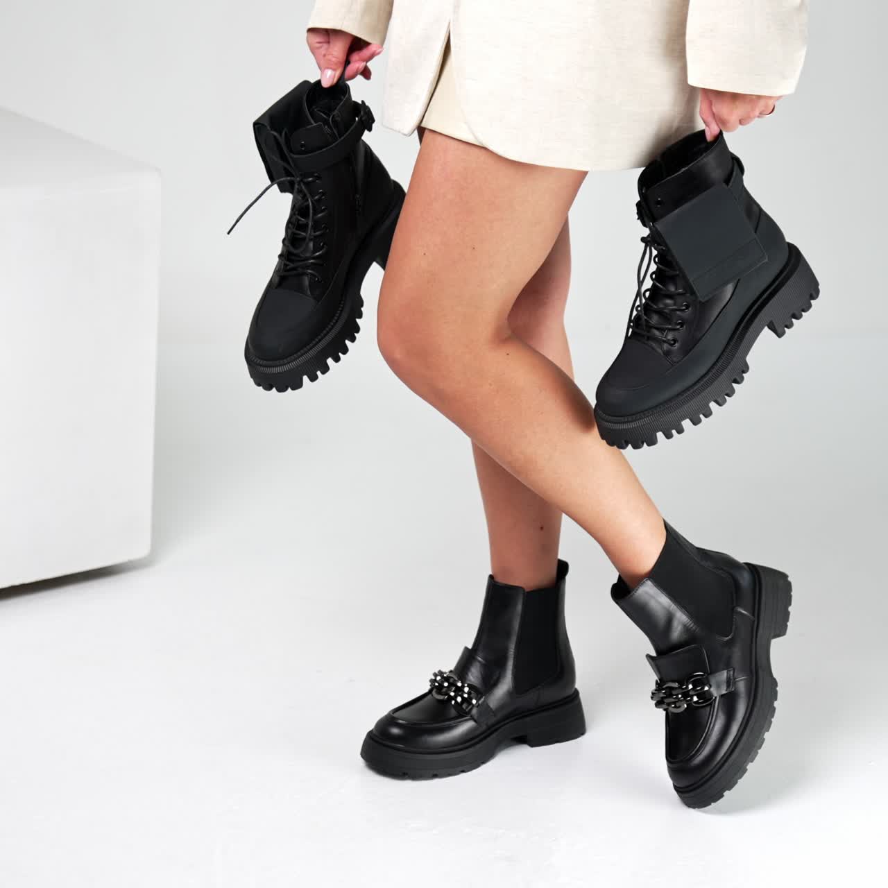 Fashionable luxury lifestyle footwear posing. Women shoe store showroom trying