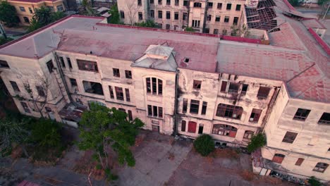 aerial orbit of the building of the former maternity of the barros luco hospital, abandoned and being a focus of insecurity, decaying structure - santiago chile