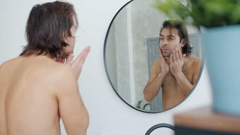 man grooming routine in bathroom