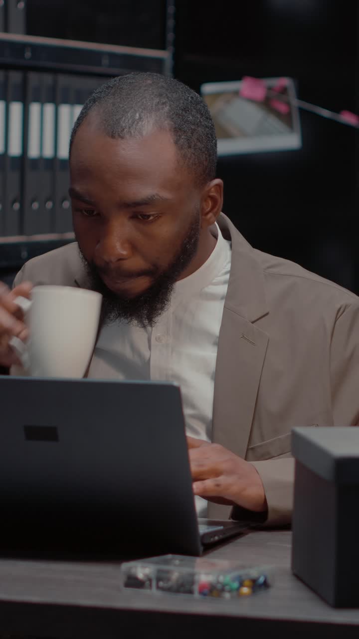 Vertical video: Male inspector studying report with criminal records