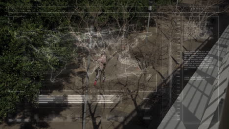 two women walking on urban pathway, with technology hud overlays scanning world map gridlines data