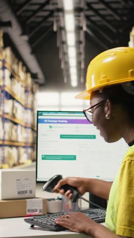 vertical video black warehouse worker managing inventory logistics with ai virtual assistant