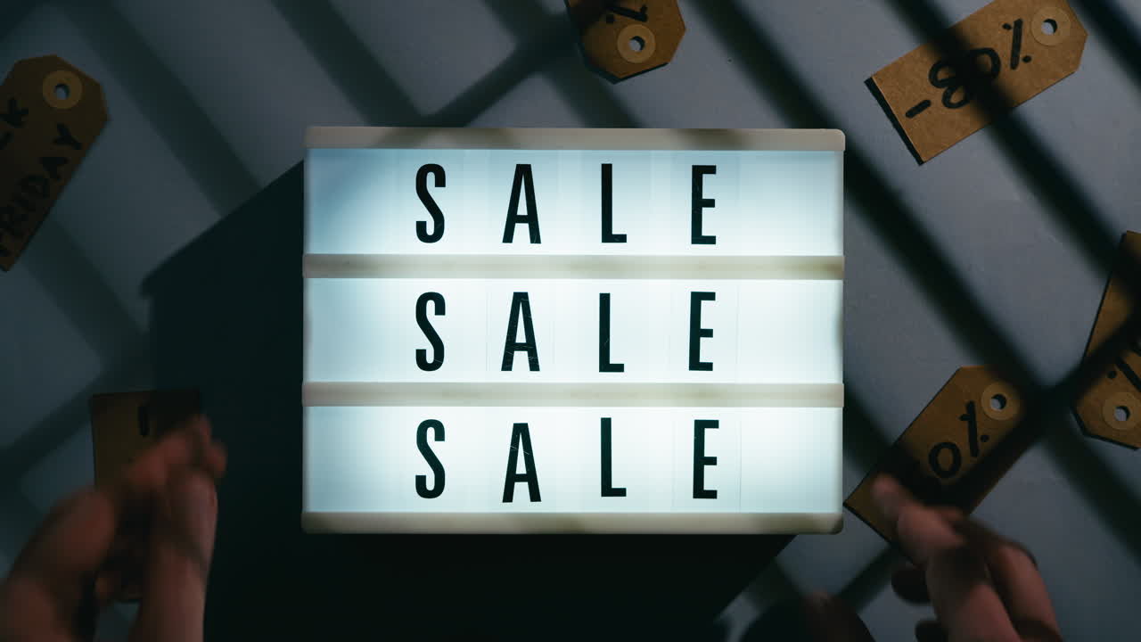 Turn on sale sign in a clothing store for Black Friday discounts
