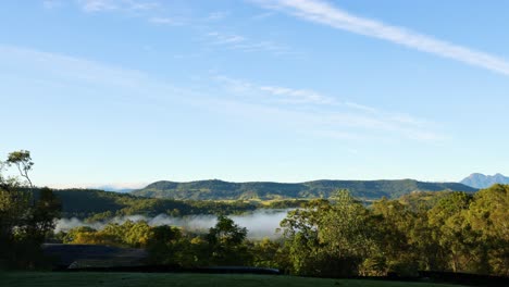 time-lapse of fog dissipating over mountains