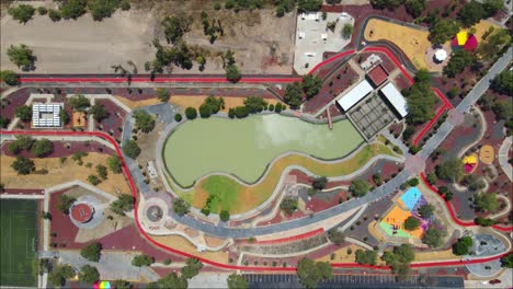 Drone-view-of-a-Construction-park-with-turquoise-pool-in-the-center-in-Mexico