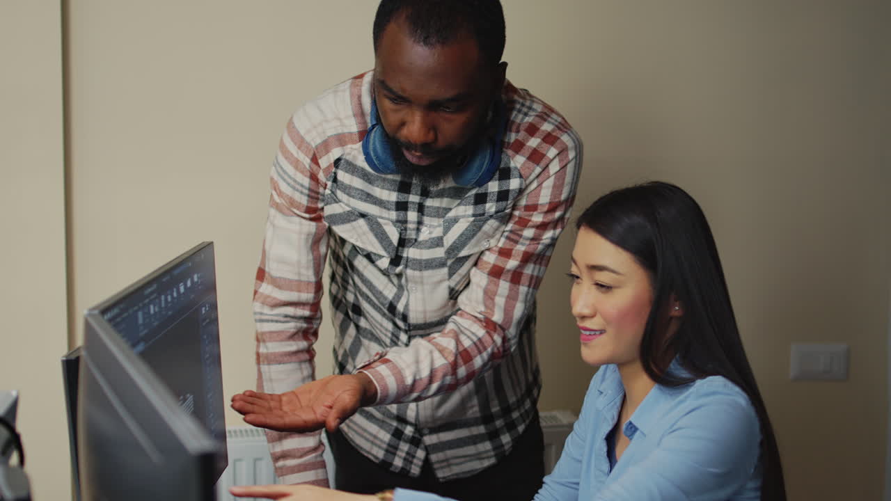 Team of diverse technicians working on machinery development