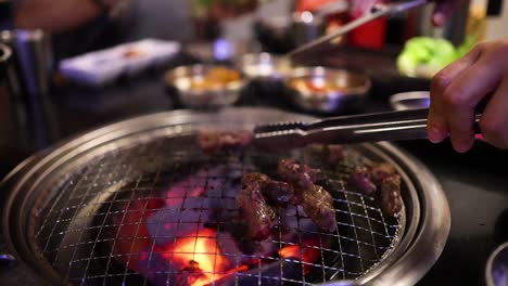 grilling meat on a barbecue grill