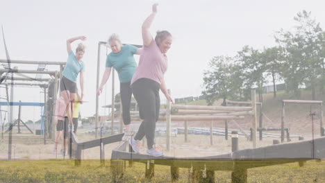 balancing on beams in outdoor course, women focusing on coordination and teamwork