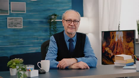 portrait of senior man chatting and listening remote teamwork