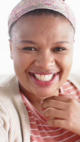 vertical video of african american woman making video call, in slow motion
