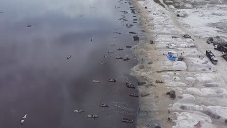 aerial shot of the salt extraction industry in the dakar lake, senegal