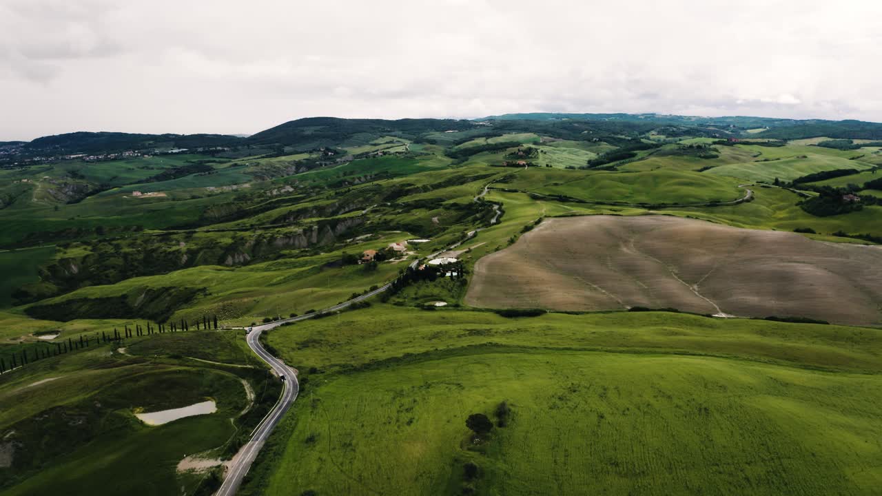 Drone shot of Italy's roaming countryside on a cloudy day