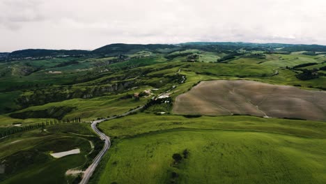 Drone-shot-of-Italy's-roaming-countryside-on-a-cloudy-day