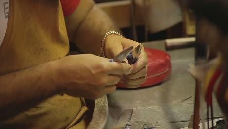 italian goldsmith at work building an engagement or a wedding ring