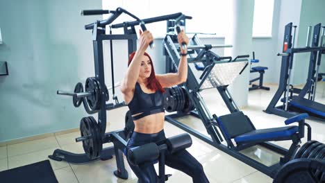 female athlete in gym. determined and strong fitness woman training in fitness club