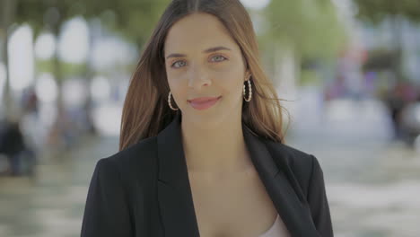 Girl-walking-on-street-and-smiling-at-camera