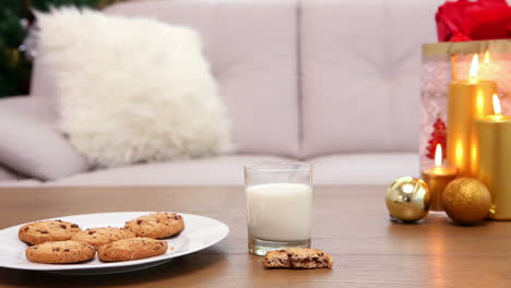 coffee table with christmas gift bag and cookies