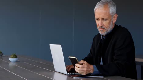 Businessman-using-mobile-phone-in-hotel-4k